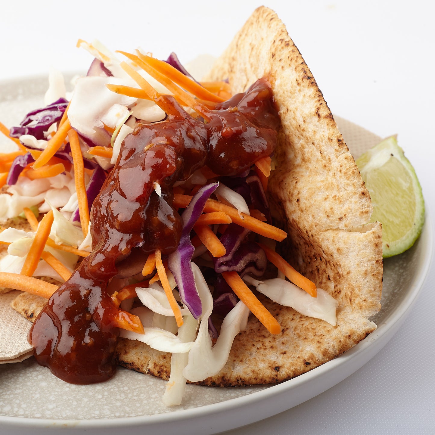 Vegan wholemeal pita pocket with generous dollop of Nan's Tomato Relish.
