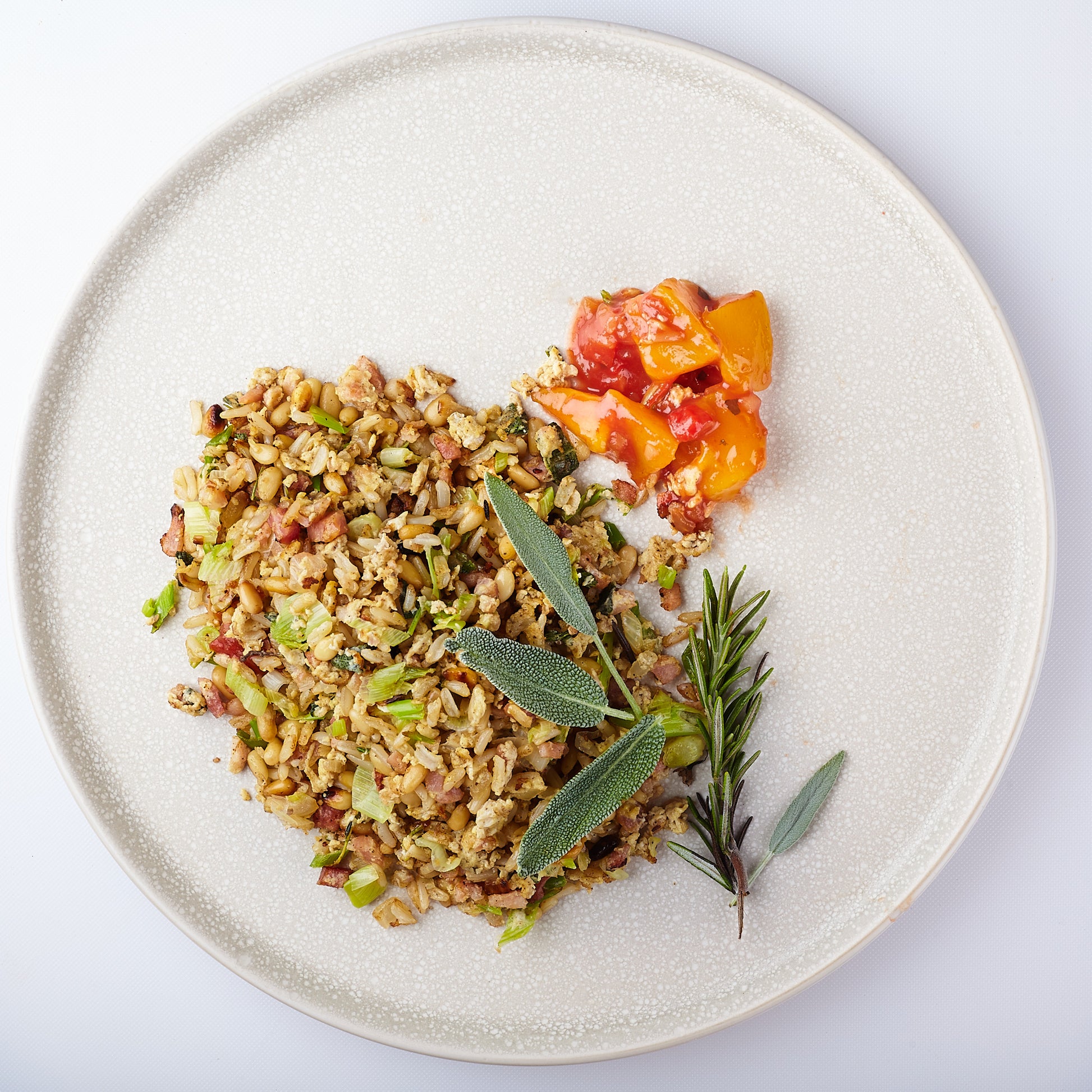 Healthy serving of ancient grain salad served with Yoko's Mango Tango Salsa garnished with sage and rosemary. Just look at those real pieces of pickled mango!